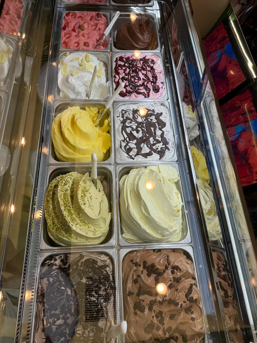 The gelato case full of fresh-churned flavors
